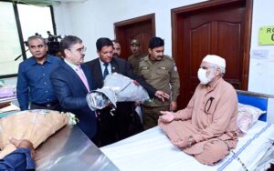 Caretaker Prime Minister Anwaar-ul-Haq Kakar visits patients who received free eye surgery from the government, in Mayo Hospital