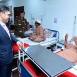 Caretaker Prime Minister Anwaar-ul-Haq Kakar visits patients who received free eye surgery from the government, in Mayo Hospital