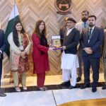Commissioner Abbottabad, Zaheer ul Islam presenting a shield to Ms Seemi A Khan, DS NIMS Islamabad