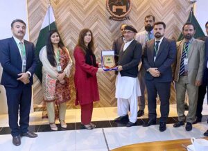 Commissioner Abbottabad, Zaheer ul Islam presenting a shield to Ms Seemi A Khan, DS NIMS Islamabad