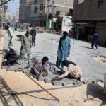 Laborers are busy in construction work of Goods Naka Road during development work in the city