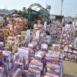 Vendors waiting for customers to sell fruit boxes at Fruit and Vegetable Market