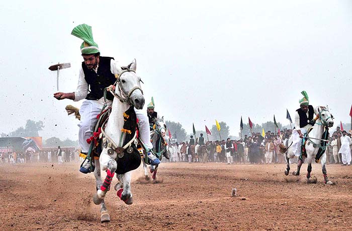 Horse riders are participating in Tent-Pegging competition organized by Qutab Shahi Awan Tent Pegging Club Soon Valley at Mela Mandi ground.