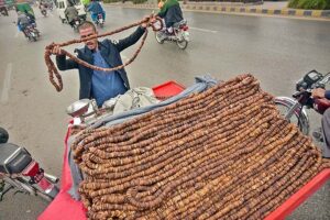  A vendor displaying fig (anjeer) on his handcart to attract the customers at Murree Road. 