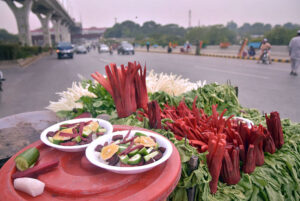  A vendor displaying salad to attract customers at Moti Mahal. 