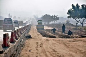 Heavy machinery being used for extension work of Islamabad Expressway during development work in Federal Capital.