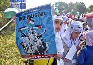 Students carrying Palestinian flags, banners and placards as they hold pro-Palestinian demonstration to show solidarity with Palestinians outside Faisal Mosque.