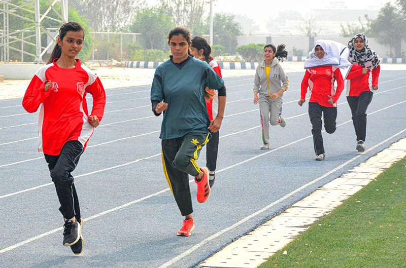 Girls Athletes participating in a race during trial of Sindh Athletes team for national athletes championship 2023 at public school.