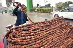 Vendor displaying Fig (Anjeer) to attract customers at roadside. 