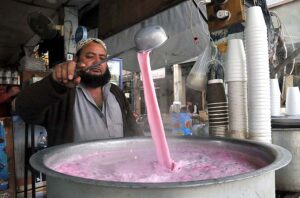A vendor busy in preparing ‘Kashmiri Tea’ to attract the customers at Aabpara in Federal Capital.