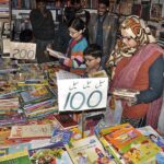 Family visiting book stall during three days National Reading Conference, Book Fair and Pakistan Learning Festival at Pak-China Friendship Center