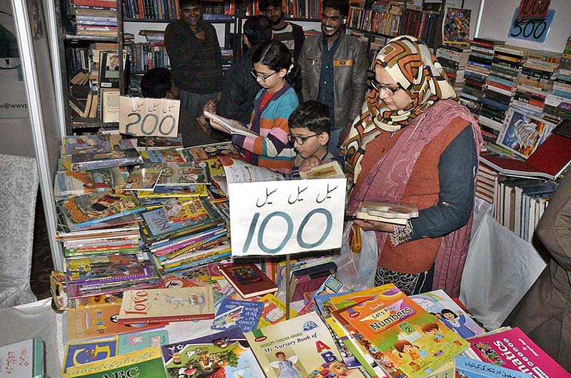 Family visiting book stall during three days National Reading Conference, Book Fair and Pakistan Learning Festival at Pak-China Friendship Center