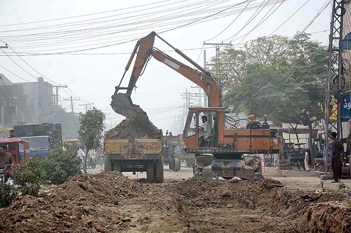 Heavy machinery being used during road construction work at Millat Road