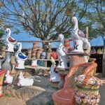 A vendor displaying decoration items to attract the customers at his setup.