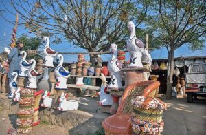  A vendor displaying decoration items to attract the customers at his setup.