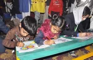 Family visiting book stall during three days National Reading Conference, Book Fair and Pakistan Learning Festival at Pak-China Friendship Center