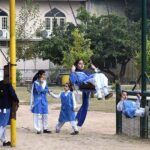 Students enjoying swings at a local park near G-6 area in the Federal Capital.