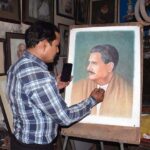 A painter giving final touch to portrait of Allama Muhammad Iqbal in connection with birth anniversary of National Poet on 09 November.