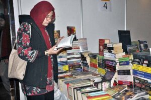 Family visiting book stall during three days National Reading Conference, Book Fair and Pakistan Learning Festival at Pak-China Friendship Center