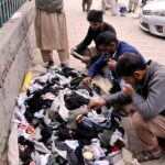 People busy in selecting and purchasing used warm clothes at weekly Sunday bazar Aabpara in the Federal Capital