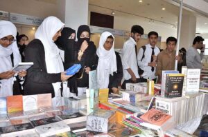 Family visiting book stall during three days National Reading Conference, Book Fair and Pakistan Learning Festival at Pak-China Friendship Center
