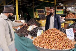A vendor selling fruits at weekly Sunday bazar Aabpara in the Federal Capital