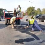 CDA staffers busy in patches work on Express way near Zero Point during maintenance work in the Federal Capital.