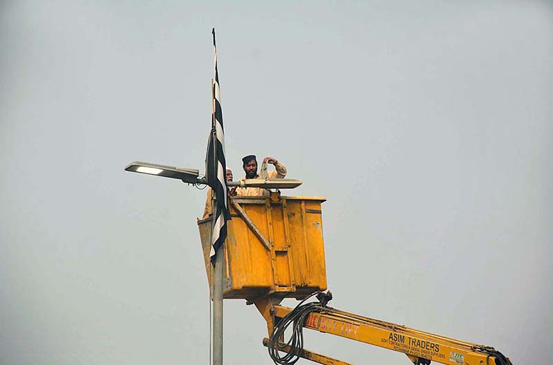 PDA workers busy in maintenance of street lights at Ring road