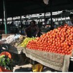 People busy in purchasing vegetables from stalls at Weekly Bazaar in Federal Capital.