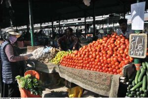 People busy in purchasing vegetables from stalls at Weekly Bazaar in Federal Capital. 