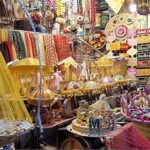 A vendor displaying henna related stuff at his shop to attract customers at Old Fort