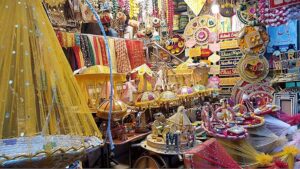 A vendor displaying henna related stuff at his shop to attract customers at Old Fort