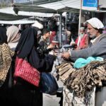 Women purchasing ‘Dandasa’ (peel of walnut tree) to be used for natural teeth whitening at Weekly Bazaar in Federal Capital.
