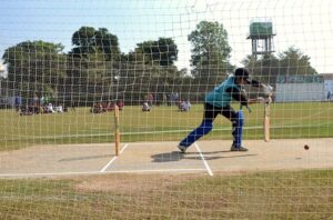 A large number of girls students standing in a queue to register for open trials for the Elite Women's Cricket League under the Lodhran Pilot Project (LPP) at Groundup Academy.