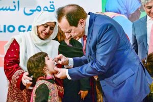 Caretaker Federal Health Minister Dr. Nadeem Jan administrating polio drops during polio campaign.