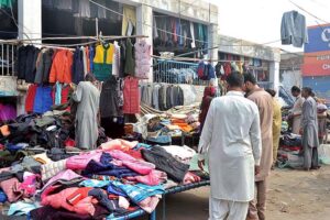 A vendor displaying decorative items to attract customers at roadside setup