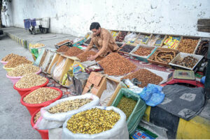 A vendor displaying and selling dry fruit on the roadside to attract customers