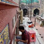 Labourers busy in renovation work at historical Mosque Masjid Wazir Khan at Walled City. The Wazir Khan Mosque is 17th century. The mosque was commissioned during the reign of the Mughal Emperor Shah Jahan as part of an ensemble of buildings that also included the nearby Shahi Hammam baths. Construction of Wazir Khan Mosque began in 1634 C.E., and was completed in 1641