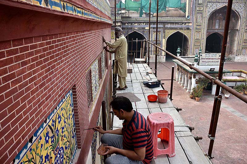 Labourers busy in renovation work at historical Mosque Masjid Wazir Khan at Walled City. The Wazir Khan Mosque is 17th century. The mosque was commissioned during the reign of the Mughal Emperor Shah Jahan as part of an ensemble of buildings that also included the nearby Shahi Hammam baths. Construction of Wazir Khan Mosque began in 1634 C.E., and was completed in 1641