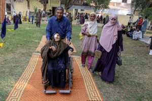 A patient being escorted from the operating theater after surgery during the 50th free eye camp organized by Hyderabad Host Lions Club International at Police Line Ground