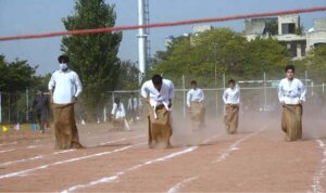 Students participate in tableau during the opening session of Annual Sports Day 2023 of Islamabad Grammer School at Multipurpose Ground G-11/3