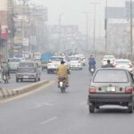 A view of vehicles on the way during smog in the city.