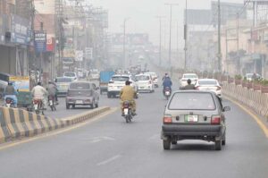 A view of vehicles on the way during smog in the city.