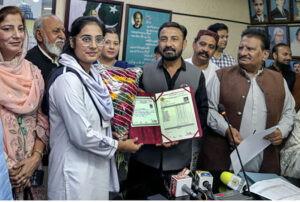 A patient being escorted from the operating theater after surgery during the 50th free eye camp organized by Hyderabad Host Lions Club International at Police Line Ground