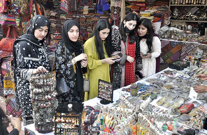 Women visiting stall during “Folk Festival Lok Mela” at Lok Virsa.