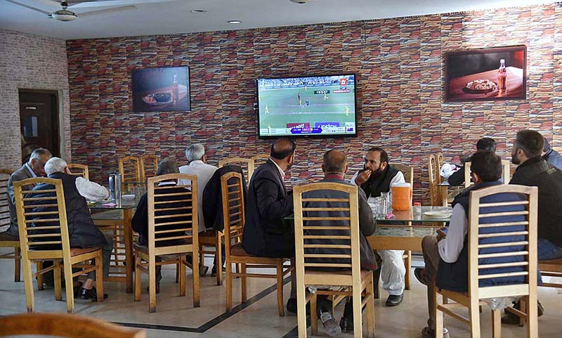 People watching final of ICC Cricket World Cup 2023 on TV in a local cafe in Provincial Capital