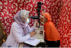 A patient being escorted from the operating theater after surgery during the 50th free eye camp organized by Hyderabad Host Lions Club International at Police Line Ground
