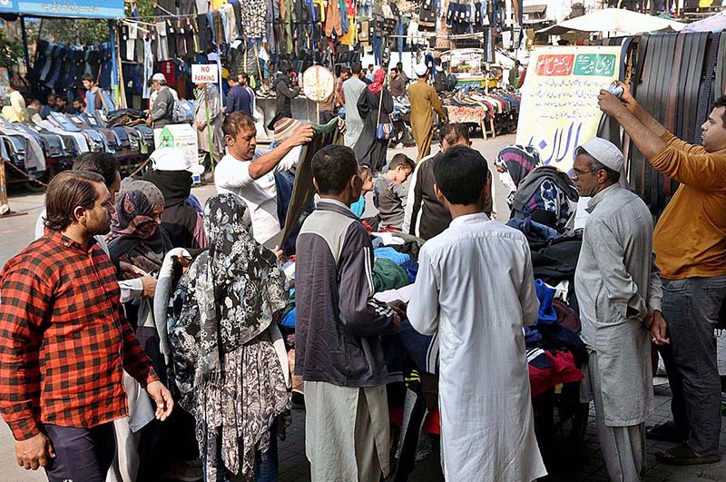 People busy in purchasing second hand warm clothes from vendors in a local market of Provincial Capital