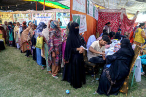 A patient being escorted from the operating theater after surgery during the 50th free eye camp organized by Hyderabad Host Lions Club International at Police Line Ground