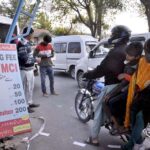 A staffer of Municipal Corporation Islamabad (MCI) receipts weekly Bazaar Parking Fees from the commuters newly launched by District Municipal Administration in the Federal Capital